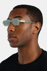 Abgewinkelte, schmale Sonnenbrille mit rechteckigem Acetatrahmen - Grün