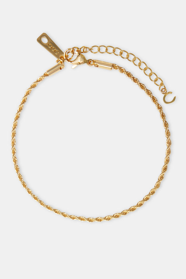 Gold rope chain anklet on white background