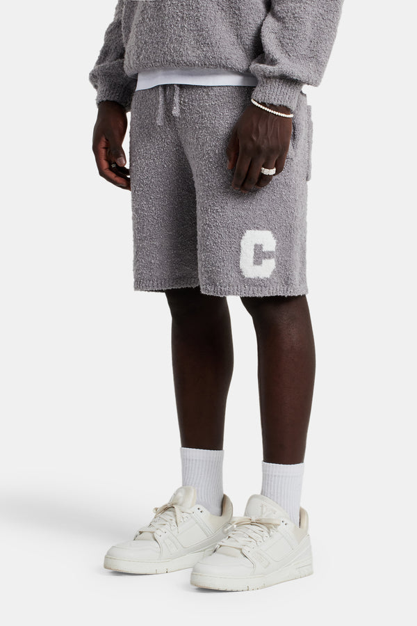 male model wearing the Textured Knitted short in grey 