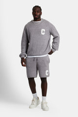 Male model wearing the Textured Knitted Sweatshirt Short Tracksuit in grey