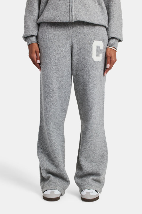 Female model wearing the wide leg knitted jogger in grey