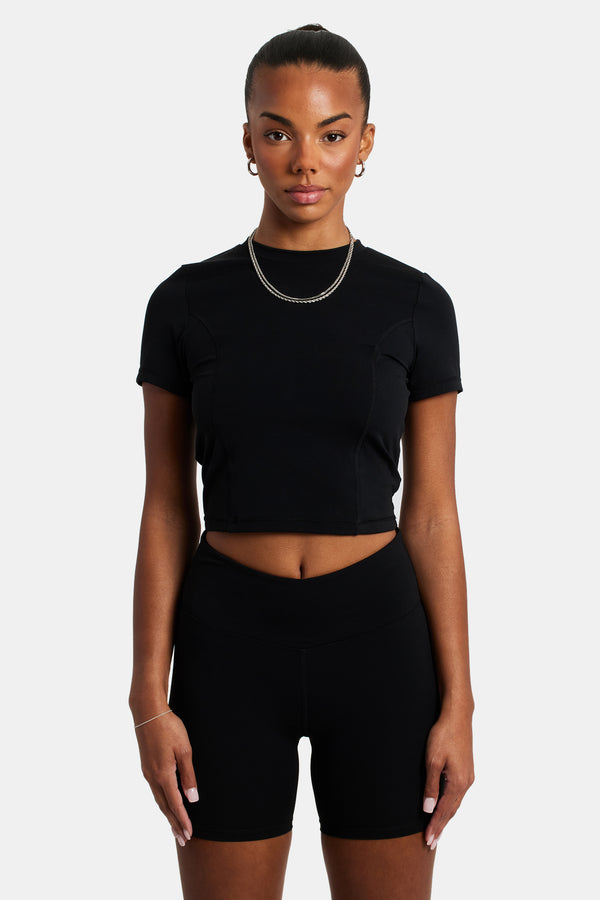 Female model wearing the ruched cycling short in black 