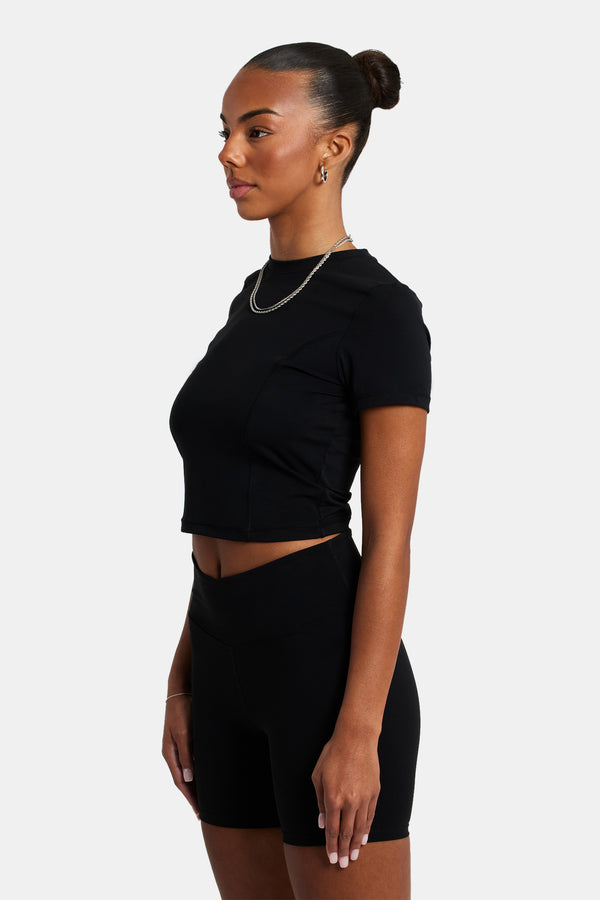 Female model earing the seam detail t-shirt in black