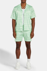 Cernucci – Satin-Shorts mit Repeat-Print – Limettengrün