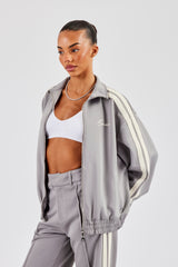 Trainingsjacke mit durchgehendem Reißverschluss und Trichterhalsband - Grau