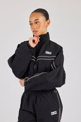 Kurze Trainingsjacke aus knitterfreiem Nylon mit Paspelierung – Schwarz