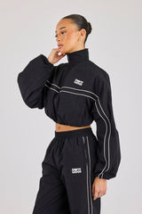 Kurze Trainingsjacke aus knitterfreiem Nylon mit Paspelierung – Schwarz