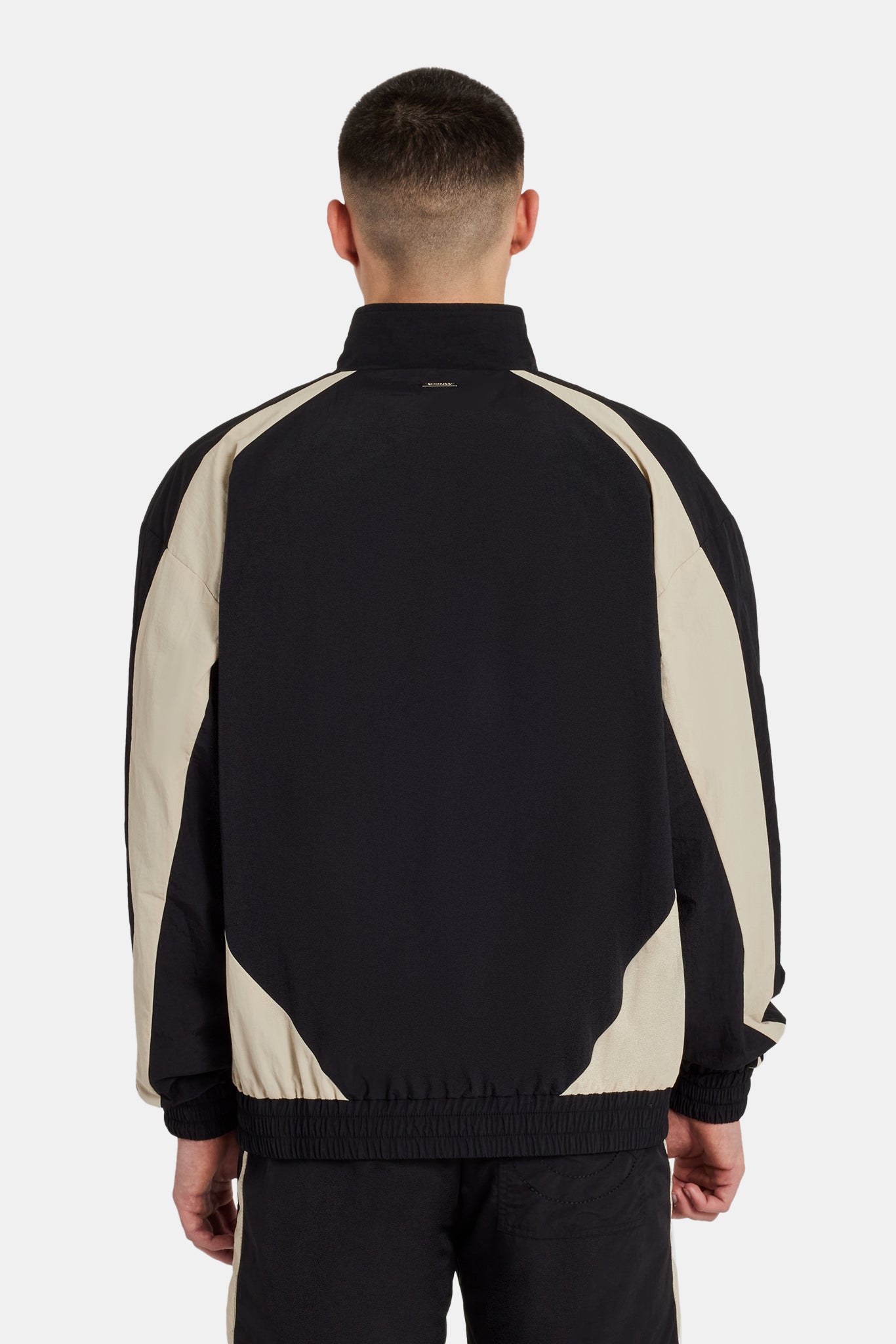 Set aus Trainingsjacke und Shorts aus Nylon mit Einsätzen - Schwarz