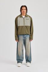 Trainingsjacke mit Trichterkragen und Nylon-Einsätzen - Khaki