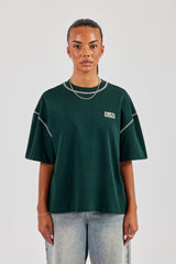 T-Shirt mit Diamantschnitt und Kontraststichen – Waldgrün