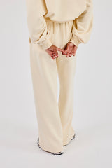 Bestickte Jogginghose mit weitem Bein – Buttergelb