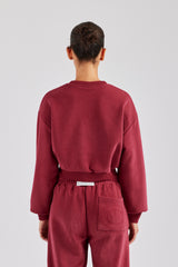 Kurzes Sweatshirt mit Glitzerapplikation - Kirschrot