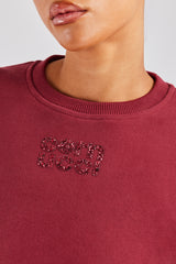 Kurzes Sweatshirt mit Glitzerapplikation - Kirschrot