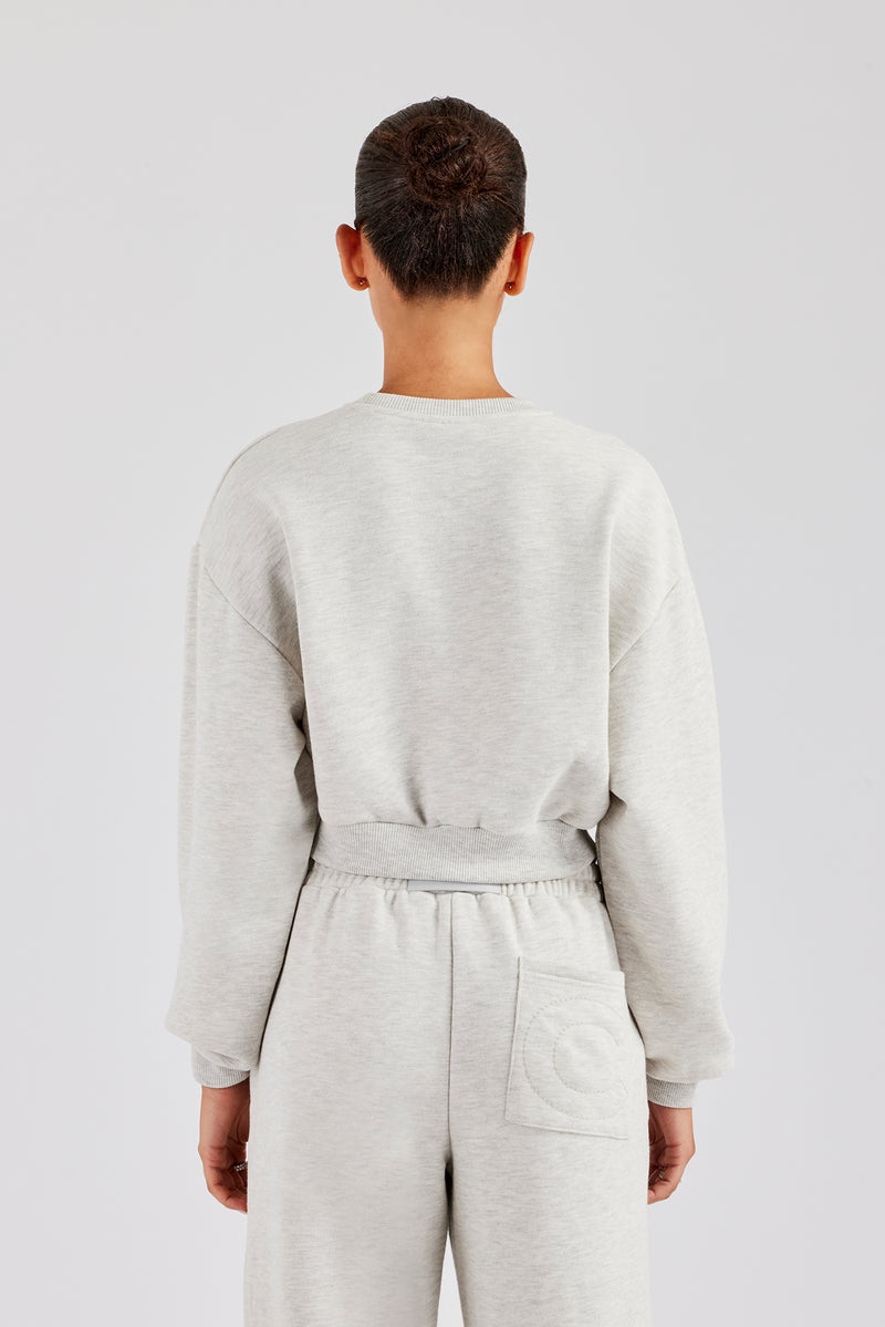 Kurzes Sweatshirt mit Glitzerapplikation - Aschgrau