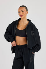 C Kapuzenpullover mit besticktem Reißverschluss – Schwarz