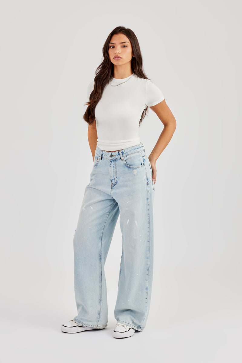 Jeans im Used-Look mit Farbspritzern – Eisblau