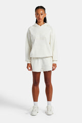 Set aus Oversize-Kapuzenpullover und Shorts mit Overlock-Muster – Off White