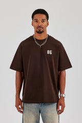 Oversize-T-Shirt mit Cherub-Rückendruck – Schokolade