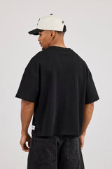 Kastenförmiges T-Shirt mit Waffelmuster – Schwarz