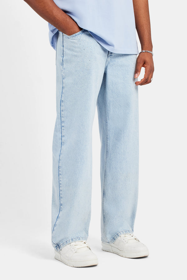 Male model wearing the baggy rhinestone jeans in Iced blue