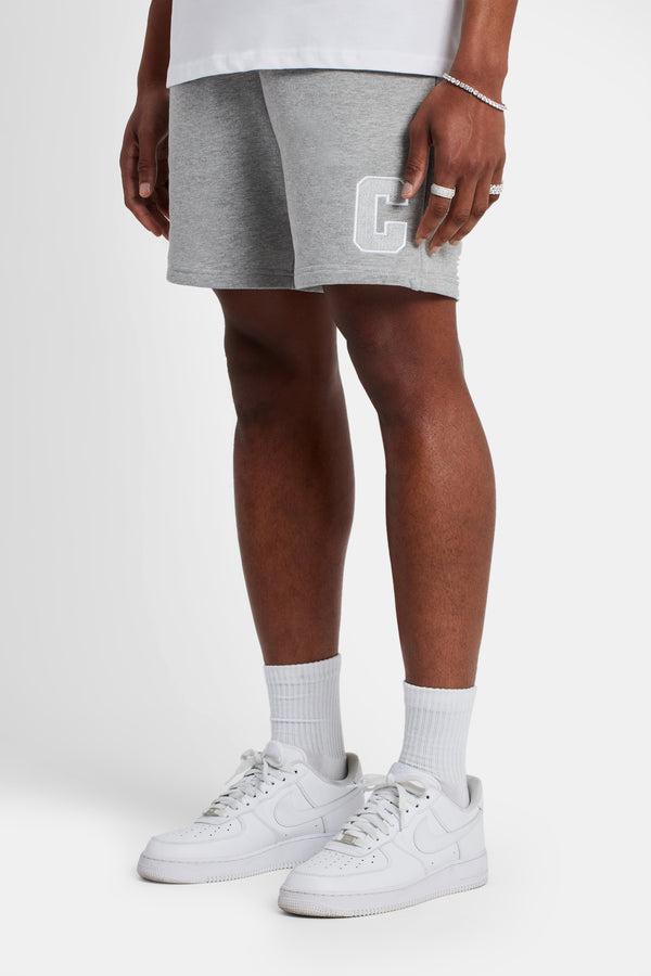 Male model wearing regular fit jersey C shorts in Grey Marl 