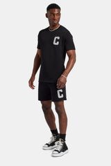 Set aus T-Shirt und Shorts mit C-Verzierung - Schwarz