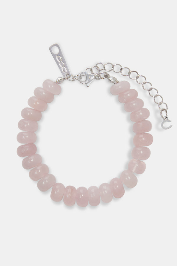 Rose quartz bead bracelet on white background