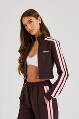 Eng anliegendes Trainings-Oberteil mit rosa Taping – Schokolade