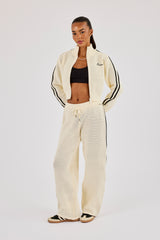 Trainingsjacke mit Stehkragen und weitem Bein, verziert mit Strickbändern – Off-White