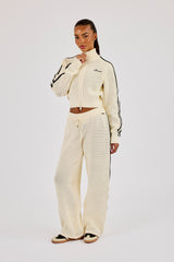 Trainingsjacke mit Stehkragen und weitem Bein, verziert mit Strickbändern – Off-White