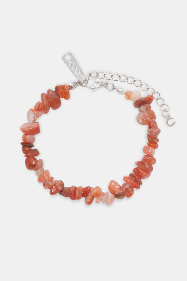 Red agate bead bracelet on white background