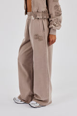 Applikationen, locker fallender Jogginganzug mit weitem Bein – Verwaschenes Taupe
