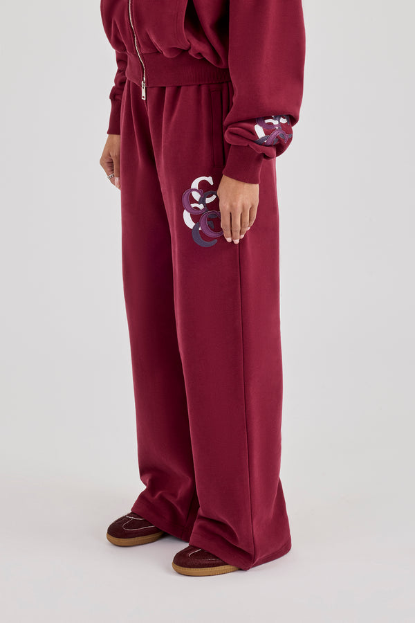 Jogginghose mit weitem Bein und mehrlagigen Applikationen – Burgunderrot