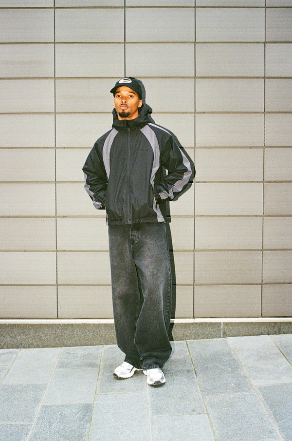 Trainingsjacke aus Nylon mit Einsätzen - Schwarz